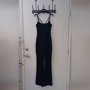 2 bodysuits. One brown, one black.